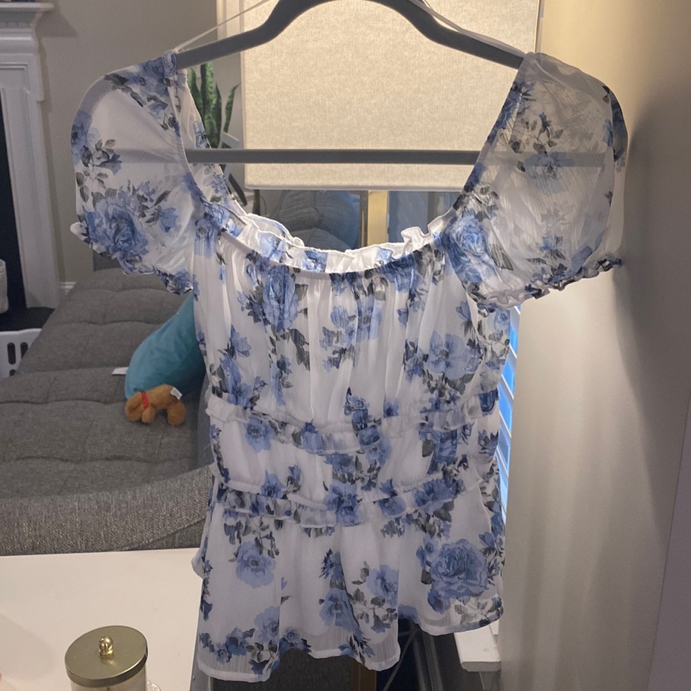 White blouse with blue flowers